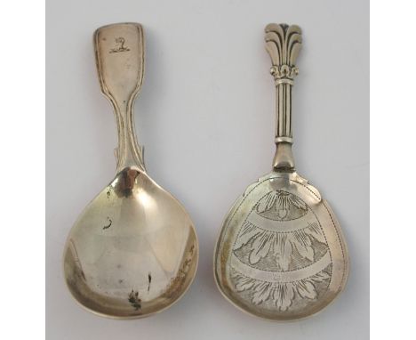 A silver caddy spoon by George Unite, Birmingham 1853, shovel shaped with foliate engraved bowl, 9.2cm long, with another cad