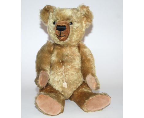A Chiltern 1940s Teddy Bear with swivel head and jointed limbs, with growler, replacement pads, 45cm (17.1/2in.) high, a ting