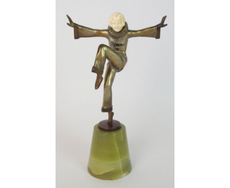 A Lorenzl ivory and bronze Art Deco figure Pierrette the figure in Pierrot costume with arms and legs raised, mounted on onyx