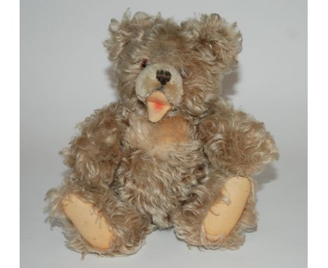 A 1950s Steiff Petsy style Teddy Bear stitched nose and open mouth, swivel head, jointed limbs and felt pads, 28cm (11in.) hi