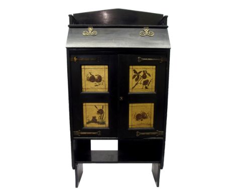 An Aesthetic movement ebonised and painted cabinet with hinged flap above a pair of panelled doors painted with mice represen