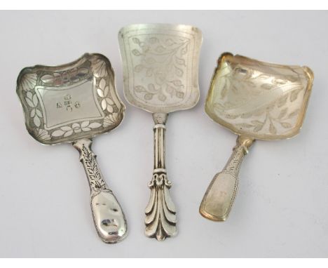 A silver caddy spoon by George Unite, Birmingham 1839, of shovel shape with foliate engraved bowl, 9cm long, with two other s
