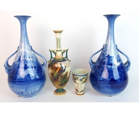 A pair of Doulton Burslem blue and white vases the twin handled vases depicting "Warkworth Castle" and "Windsor Castle", (som