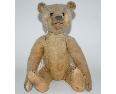 An early Steiff Teddy Bear with boot button eyes, pronounced clipped muzzle, stitched nose, mouth and claws, swivel head, joi