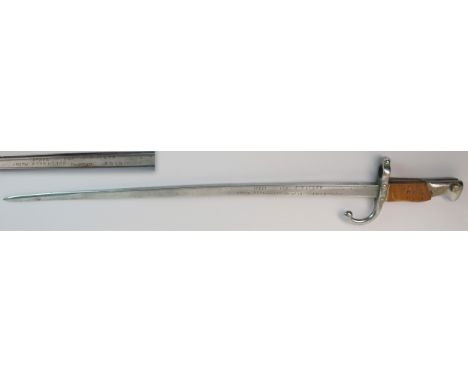 A French bayonet the top of the blade inscribed in French, dated 1880, also stamped "taken by S Mateer", the blade stamped "A