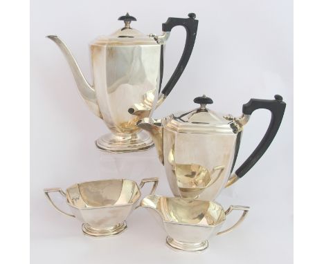 A four piece silver tea service by James Carr, Birmingham 1938, of tapering rectangular form, with canted corners on stepped 