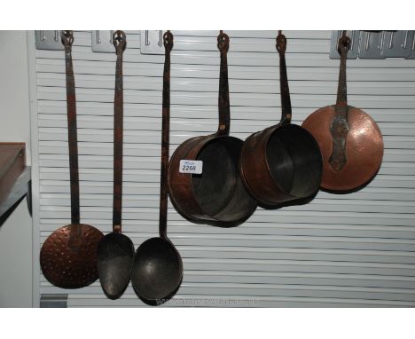 Two Copper Saucepans (one being lidded), ladle and draining spoon, etc on rack