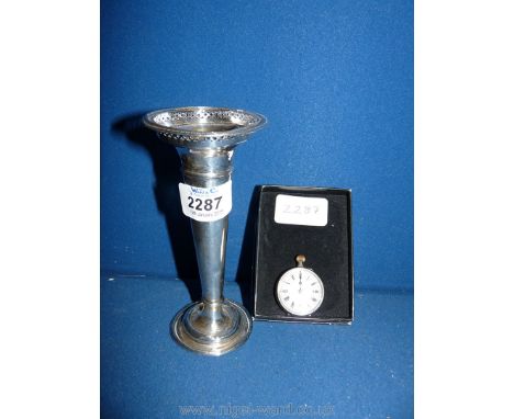 A silver hallmarked trumpet vase and a silver pocket watch with an elegant enamel face.