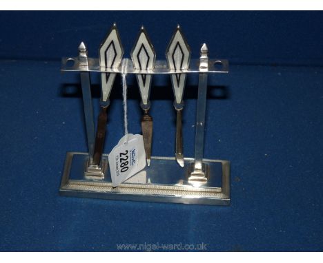 A stunning Art Deco silver and enamelled Manicure set with silver architectural rectangular stand, 5" long. The three nail to