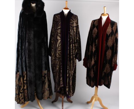 A full length black and gold silk velvet fur-trimmed hooded cloak by Gaggio, Italy; with a Charles Patricia Lester purple and