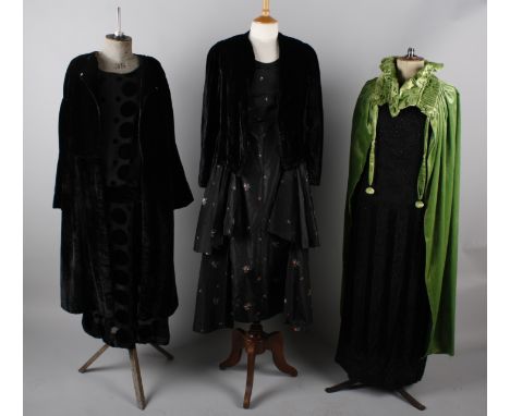 A 1920s black silk beaded dress with tassels, with a 1920s devore evening dress, a green velvet cloak, a black taffeta party 