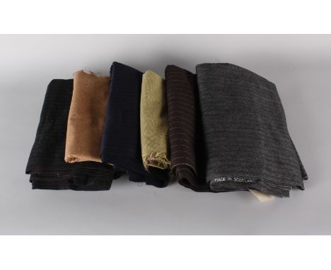 A quantity of vintage wool, tweed and fabric, including: a bolt of dark brown pinstripe suiting, a bolt of charcoal grey wool
