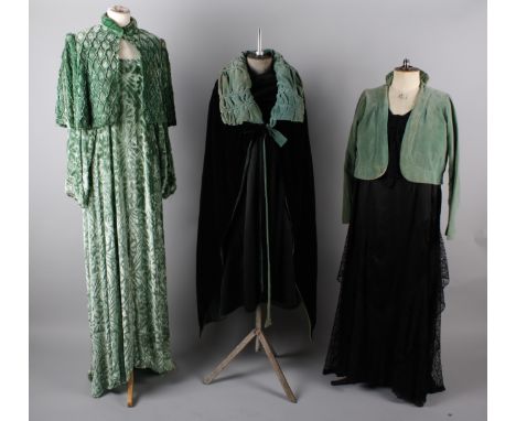 A 1930s black taffeta gown with tiny rosebud design; with a 1930s green velvet shoulder cape, a 1930s black satin dress with 