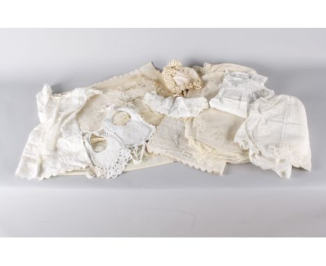 A tin trunk containing a large quantity of late 19th and early 20th century children's costume, including: gowns, nightdresse