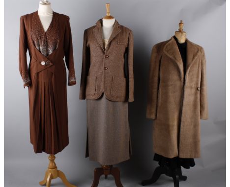 A 1930s velvet and georgette patterned dress with integral jacket; together with a 1930s black satin dress, a 1930s brown cre