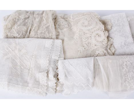 A collection of antique and vintage wedding veils, including: a late 19th century cream veil, a mid 20th century net veil dec