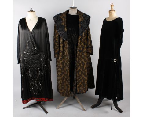 Six items of ladies costume from the 1920s including: a brocade evening coat, a beaded black satin dress trimmed with red bea