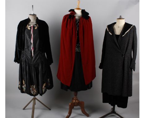 Six items of ladies costume circa 1920/30s, including: a black brocade coat with a fur collar, a black silk velvet jacket, a 