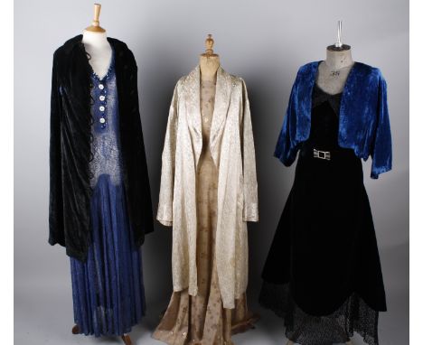 A 1930s gold floral brocade full length evening gown; together with a 1930s blue lace full length dress trimmed with sequins,