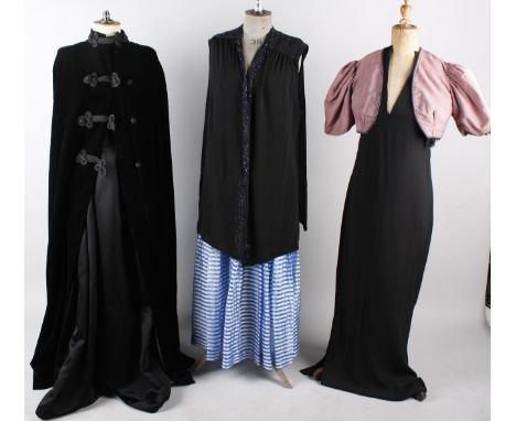 A 1950s black ballgown with underskirt; together with a 1960s full length pink evening coat, a black crepe evening dress with