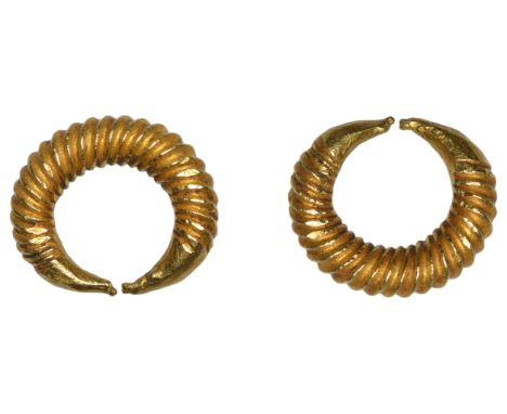 First Millennium BC, Ring Money, a small solid penannular cable-twist gold band of plain metal with finely tapered and flatte