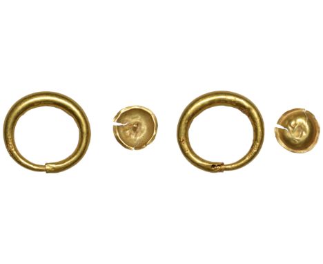 First Millennium BC, Ring Money, a small hollow penannular smooth gold band of plain metal with one tapered end fitting insid