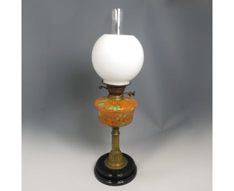 An antique brass Oil Lamp, painted bohemian glass reservoir raised on brass base, stamped 'British Made', H 64 cm. 