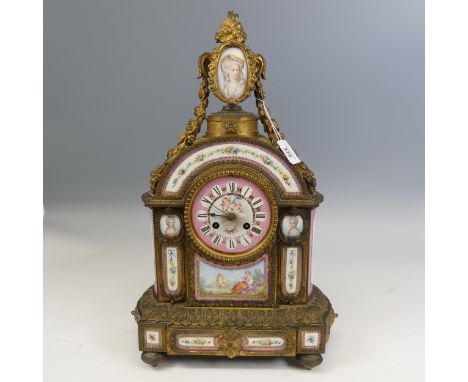 A late 19th century French gilt metal and Sevres style porcelain inset mantel Clock, in the Louis XVI style,&nbsp;the panels 