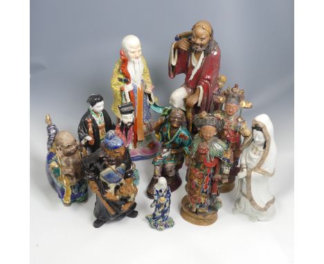 A quantity of 20thC and earlier Chinese pottery and porcelain Figures, comprising a large well decorated Elder, a 19thC porce