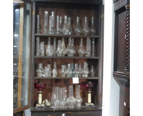 A pair of antique cranberry glass Oil Lamps, H 40 cm, together with a small quantity of brass Oil lamp parts, including ; bur