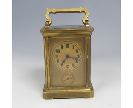 An early 20th century French brass alarm carriage Clock, gilt arabic dial above&nbsp;subsidiary arabic alarm dial,&nbsp;with 