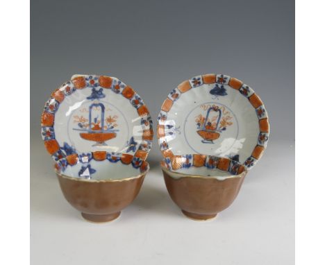 An 18thC Chinese cafe-au-lait porcelain Tea Bowl and Saucer, c. 1750, decorated to the well with floral baskets in blues and 