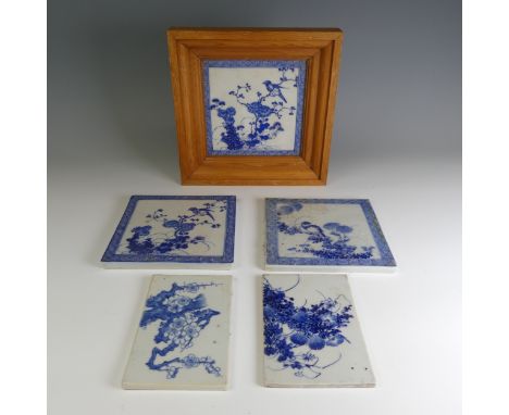 A matched set of three antique Chinese porcelain blue and white Tiles, each depicting exotic birds amongst prunus, enclosed w