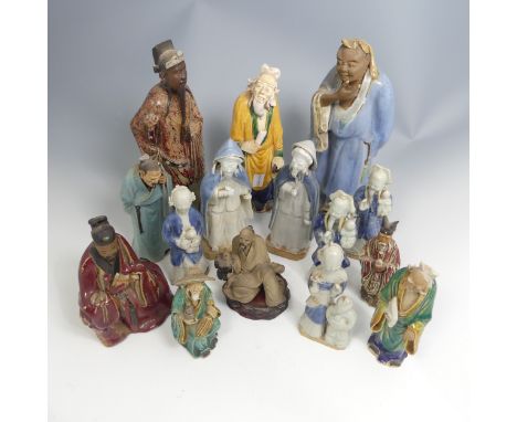 A quantity of decorative Chinese pottery Figures, comprising six early 20thC depictions of Elders, together with nine further