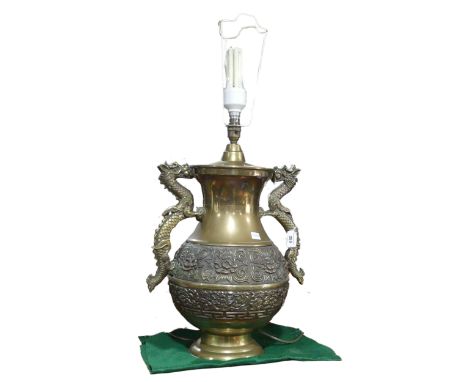 A Chinese style brass twin handled table Lamp, handles in the shapes of dragons, H 75 cm. 