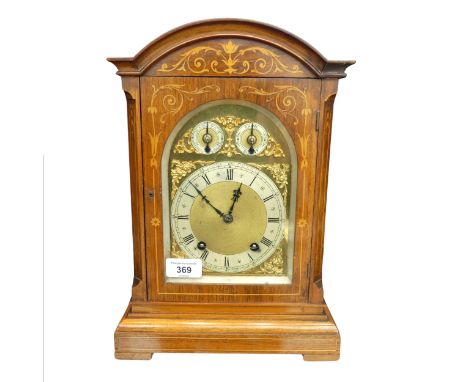 A London Camerer Kuss &amp; Co marquetry inlaid mantel Clock,&nbsp;the arched brass dial with foliate scroll spandrels, silve