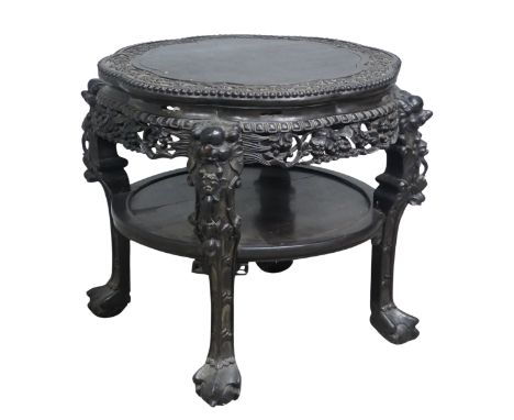 A large Chinese carved hardwood centre / occasional Table, circa 1900, top with smooth flower centre surround by floral carvi