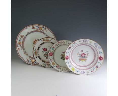 An 18thC Chinese porcelain famille rose Charger, c. 1730, the well decorated with famille jaune bowl containing exotic fruits