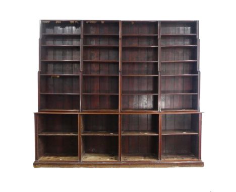 A very large unusual mid 19th century mahogany waterfall open Bookcase, made of two large sections, panel-back top with adjus