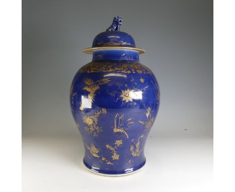 A large antique Chinese porcelain powder blue Temple Jar, in the Kangxi style, decorated in overglaze gilt depictions of butt