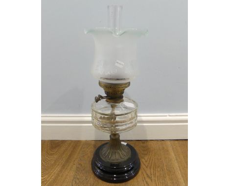 An antique clear glass and brass Oil Lamp, stamped 'English Made', with fluted frosted and etched glass shade, H 55 cm. 