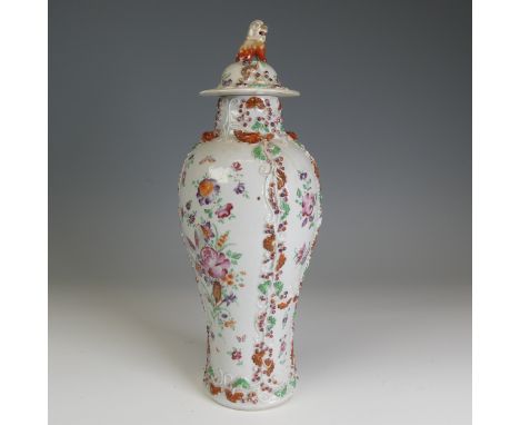 A 19thC Chinese export porcelain slender baluster Vase, and cover, decorated in floral motifs with relief work vines, the Cov