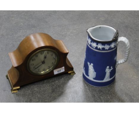 Blue and white water jug and early 20th century inlaid mantle clock 