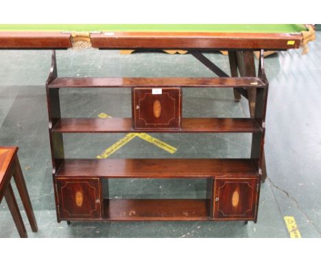 A wall hanging shelf unit with three inlaid Georgian doors 