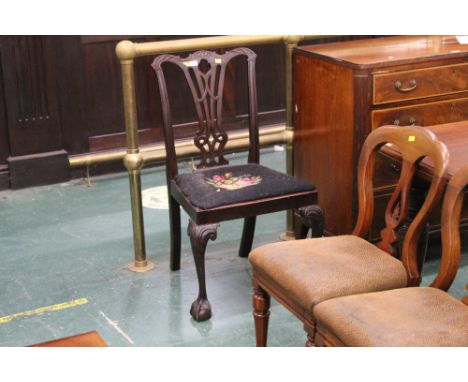 A dining chair with carved back, knees and claw and ball feet, also fitted with a tapestry seat