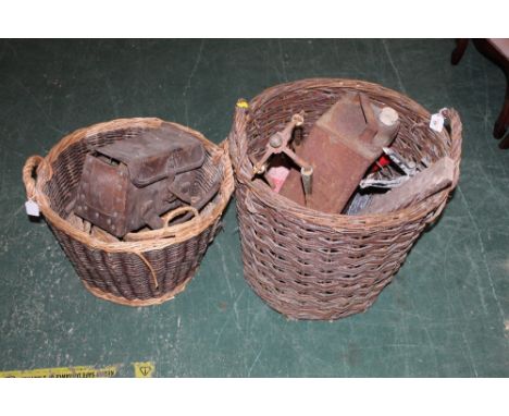 Two wicker log baskets, a metal shell oil can, fire irons, baskets , tools etc 
