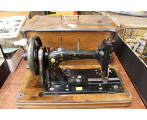 Vintage hand sewing machine with inlaid case 