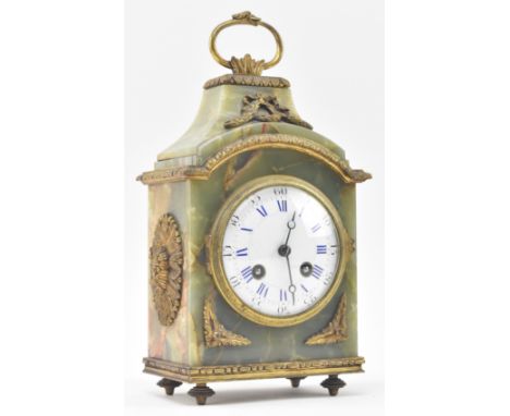A French continental early 20th century green onyx &amp; brass mounted 8-day mantle clock. The clock having a ring handle ato
