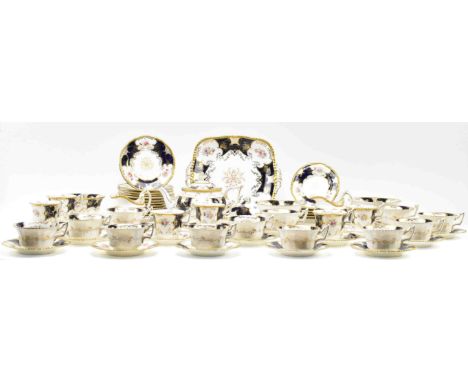 Coalport - an early 20th century cobalt and gilt porcelain china part tea service. Each item decorated in Regency style with 