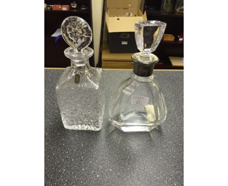 A Whitefriars decanter; together with a silver-necked example by Mappin & Webb